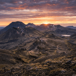 Volcanic mountains with steam vents at sunrise in Iceland